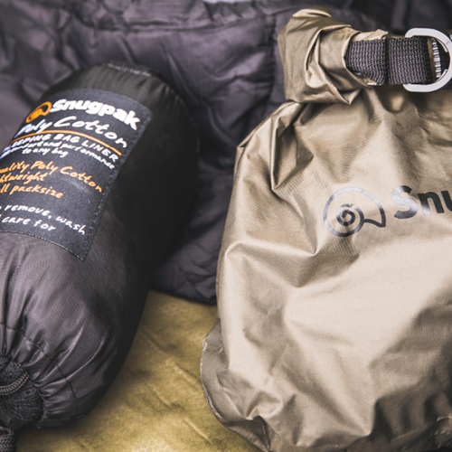 Selection of Snugpak camping essentials, including sleeping mat, sleeping bag liner and dry sack. 